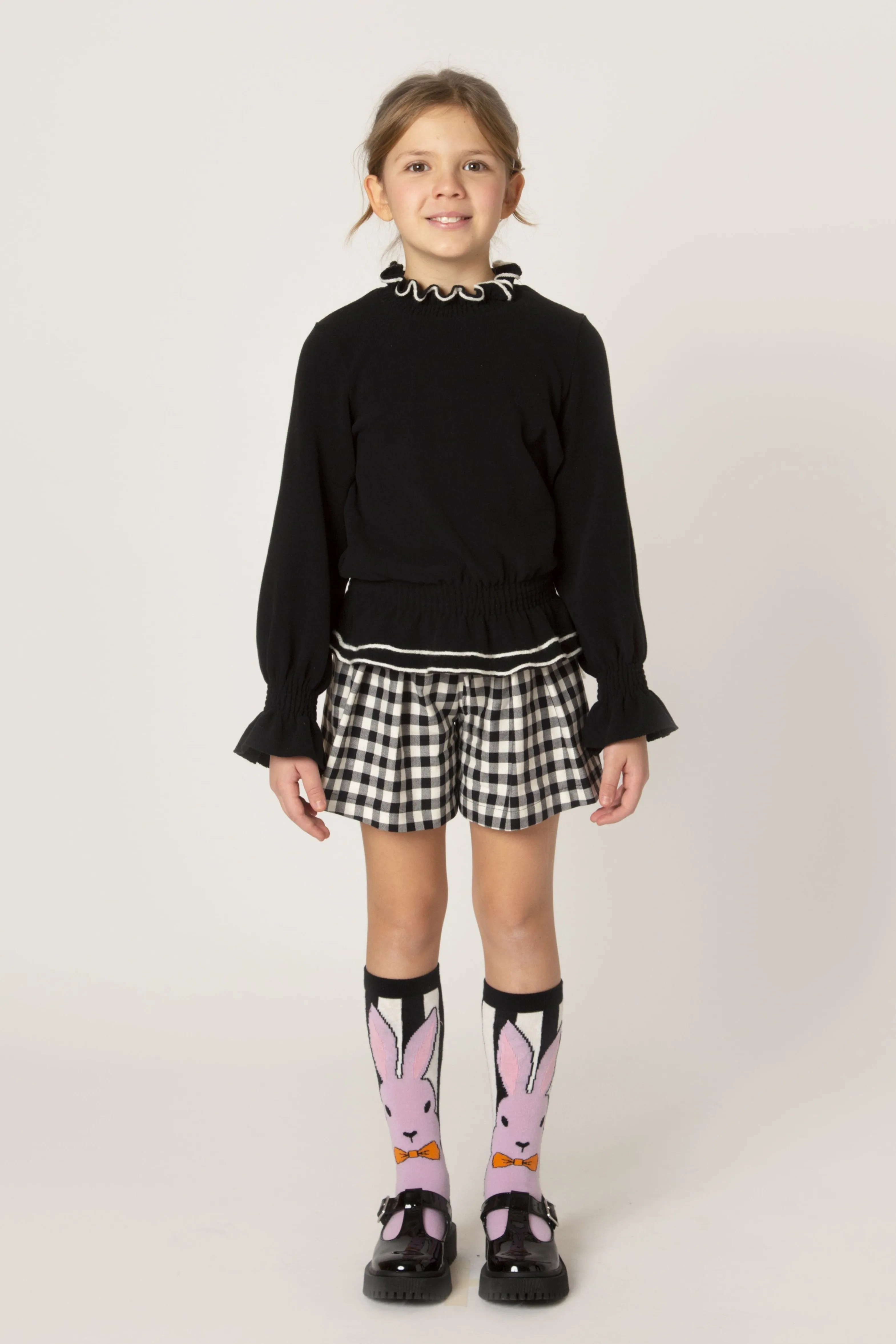 Peplum black top by Piccola Ludo