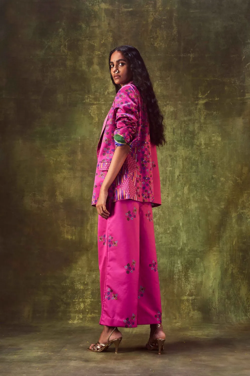 Printed jacket with cowl neck top paired with wide leg pants