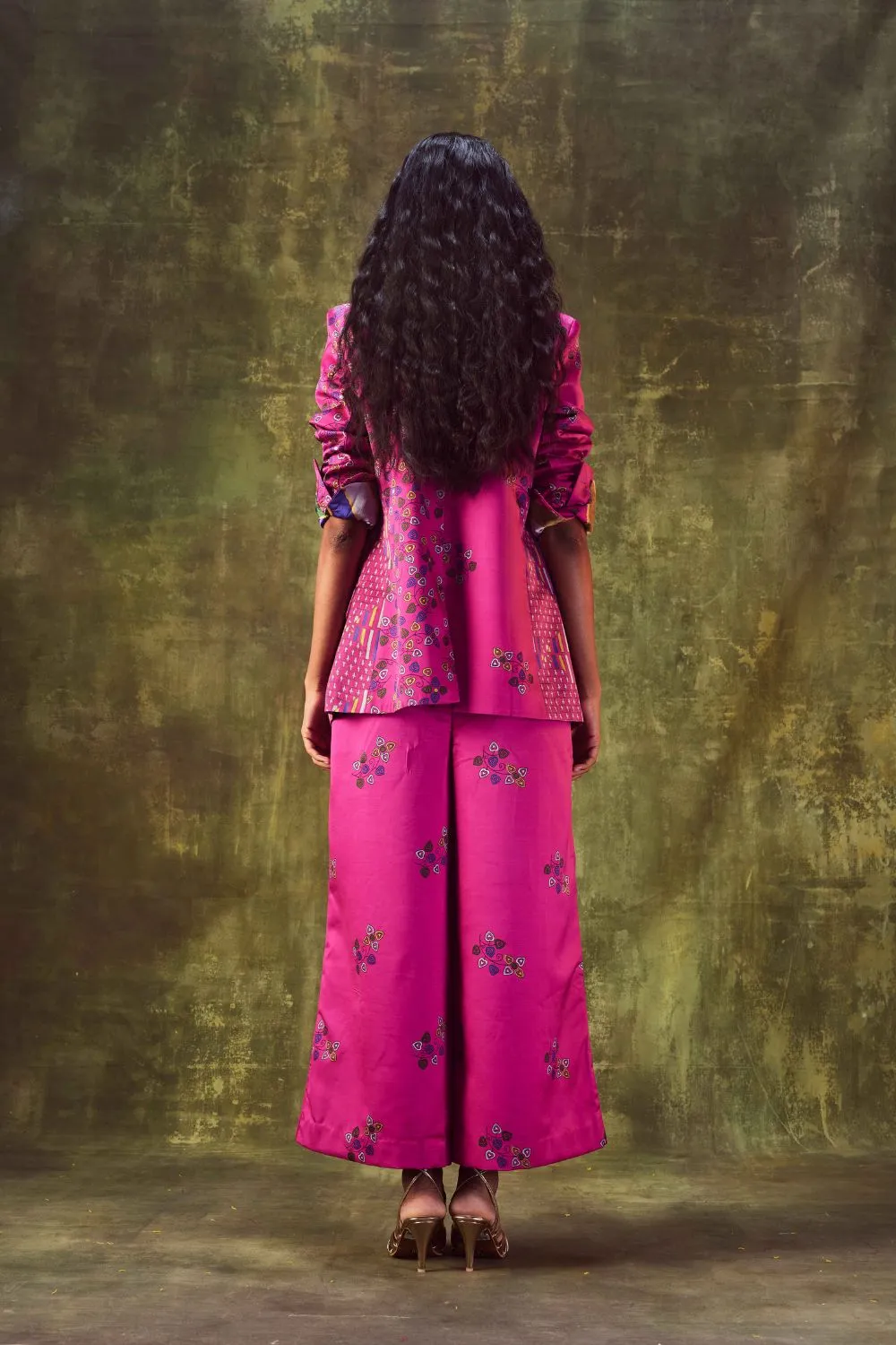 Printed jacket with cowl neck top paired with wide leg pants